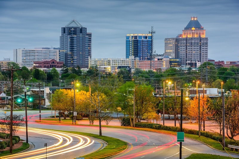 Greensboro, North Carolina skyline with high-rise buildings and spring foliage