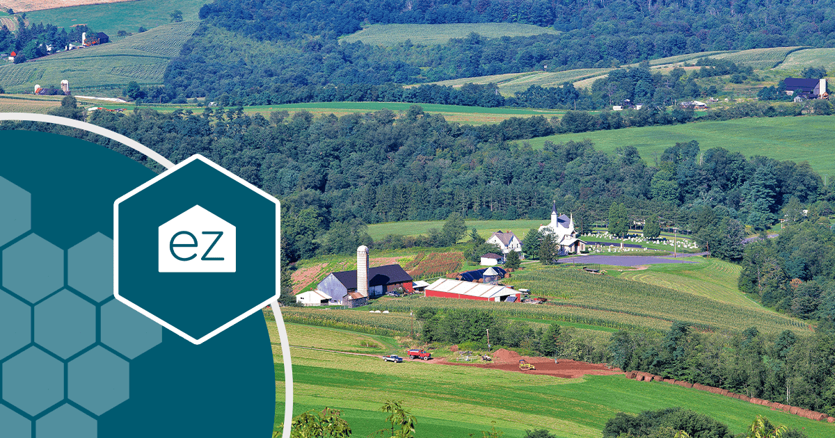 Rolling farmland, barns, and a church steeple near Lewisburg, West Virginia