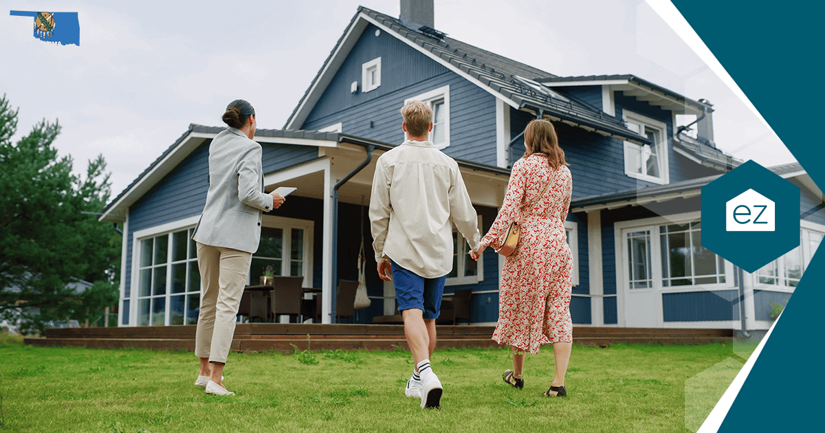 An Oklahoma real estate agent walking two clients toward a two-story home during a showing