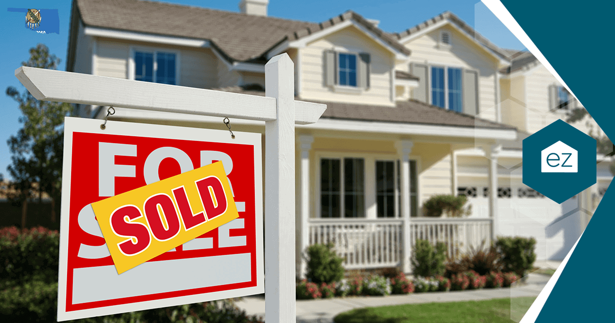 A for sale sign with a sold rider in front of a two-story Oklahoma home