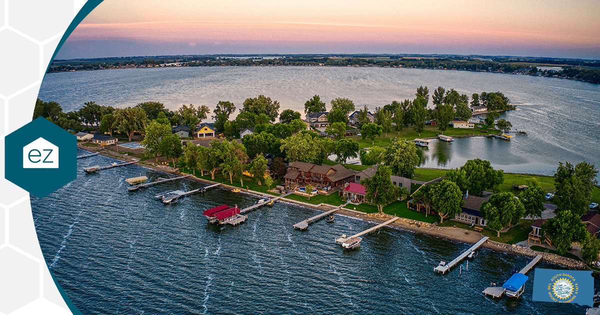 South Dakota lakeside homes with private docks reaching into the water at sunset