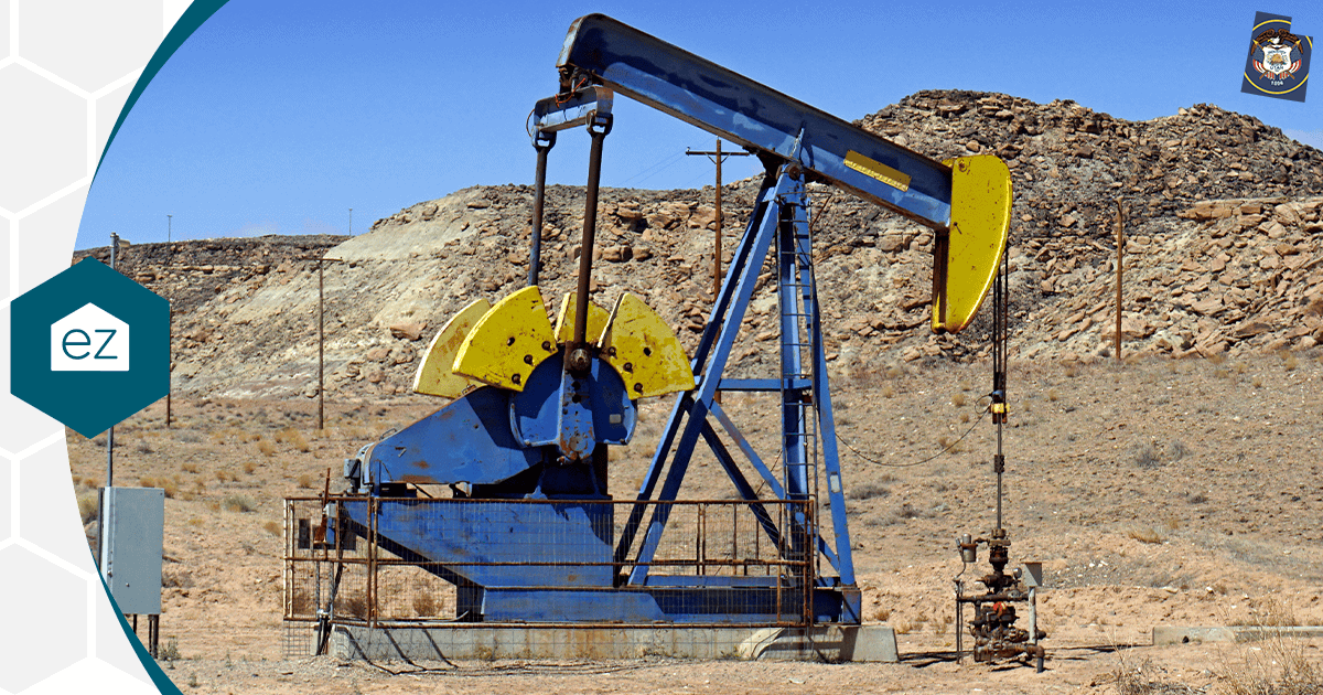 An oil pumpjack working in a dry rocky Utah landscape