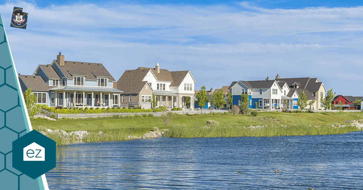 Two-story homes along the water in a Utah suburb, the kind of attached and detached stock driving county price gaps