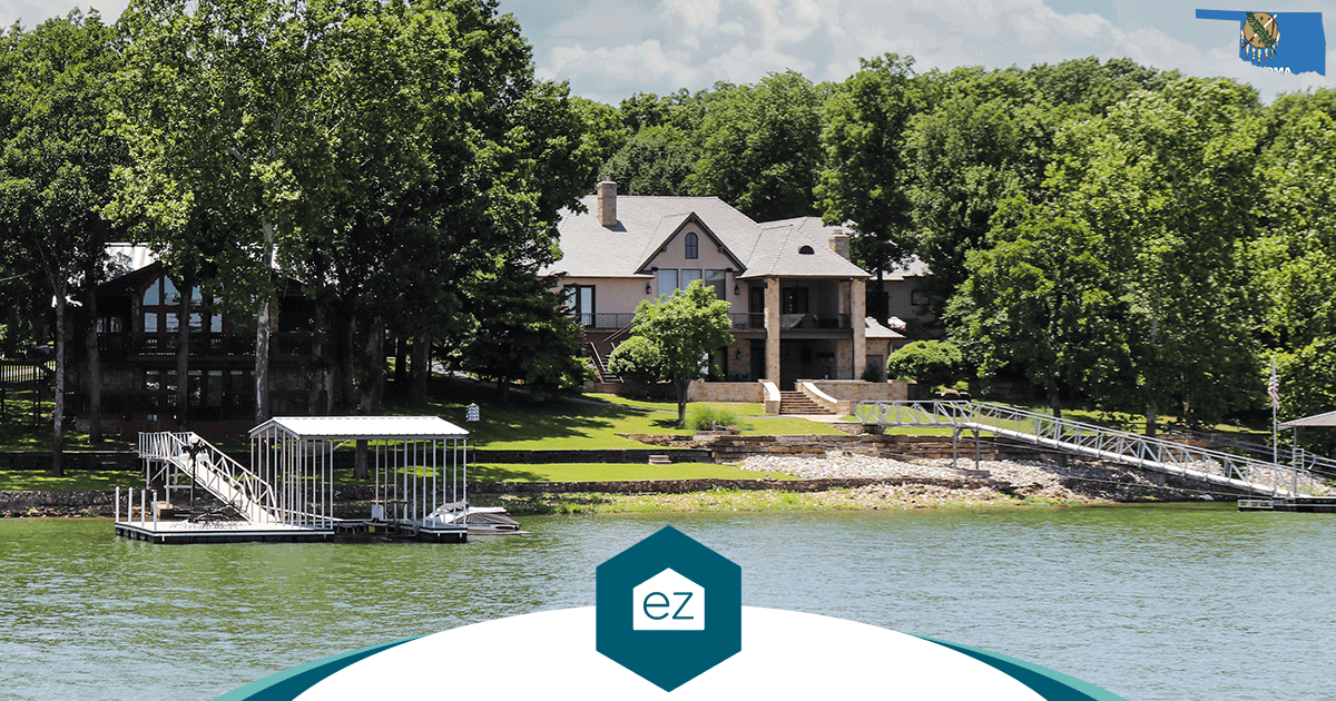 A large lakeside Oklahoma house with two docks extending into the water