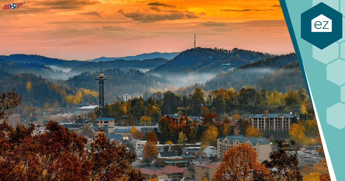 Gatlinburg, Tennessee at sunset surrounded by autumn trees