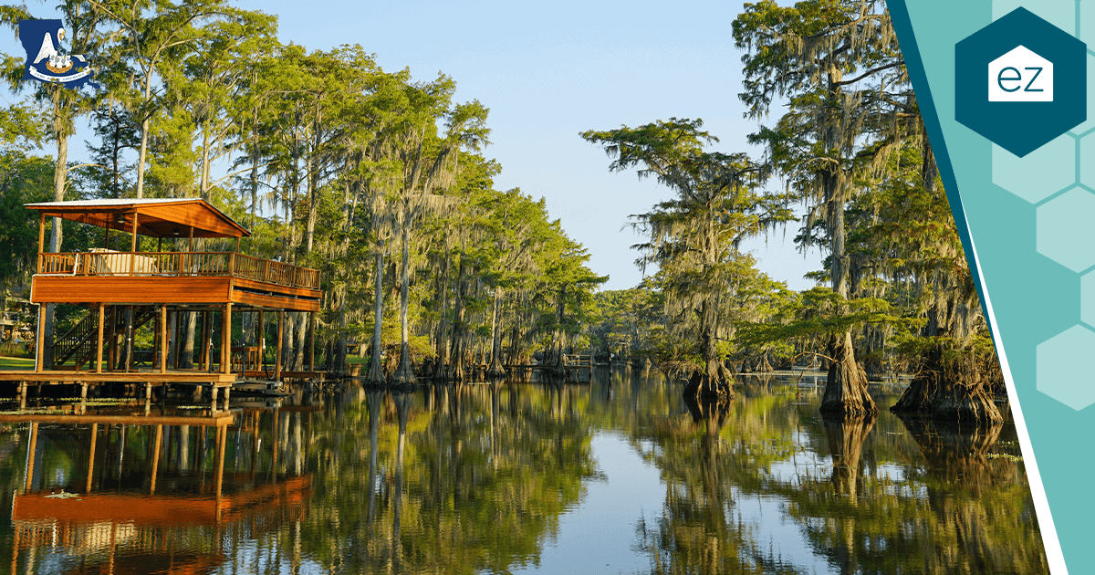 A wooden lake house on stilts along the shore of Caddo Lake