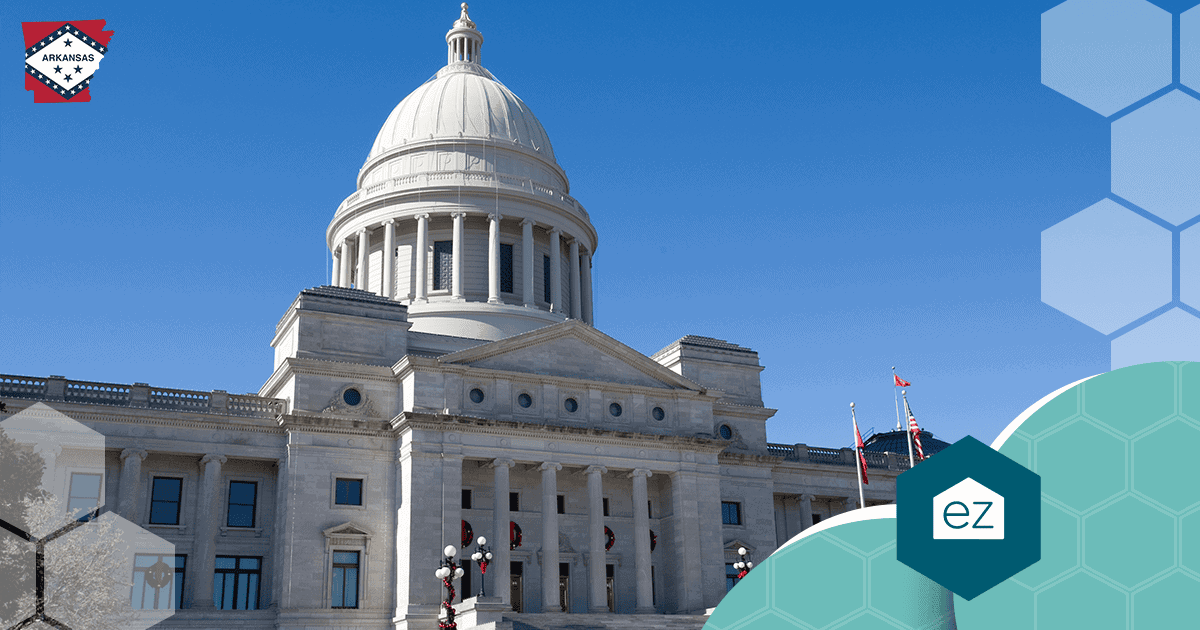 The Arkansas State Capitol building with its domed roof under a clear blue sky in Little Rock.