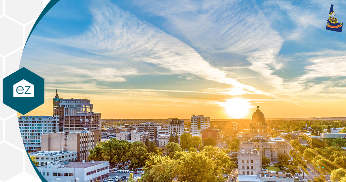 Boise, Idaho downtown skyline at sunset with the state capitol dome and the Treasure Valley foothills behind it