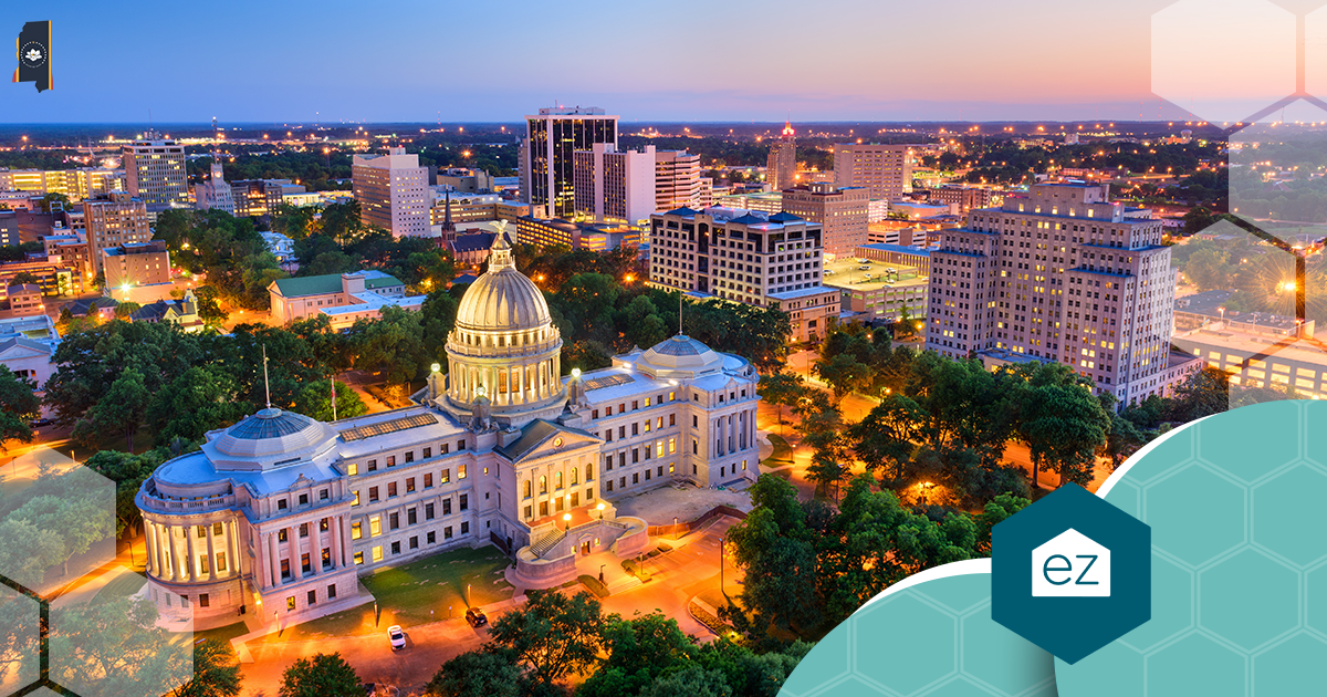 Aerial view of the illuminated Mississippi State Capitol in downtown Jackson at dusk
