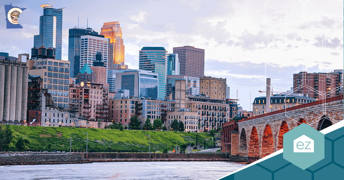 Minneapolis and St. Paul skyline with the Mississippi River and a stone arch bridge
