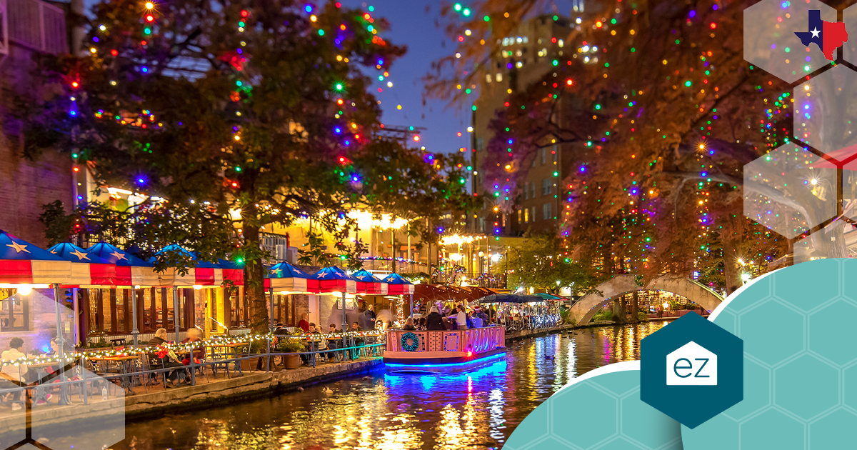 The San Antonio River Walk glowing at night with riverfront dining.