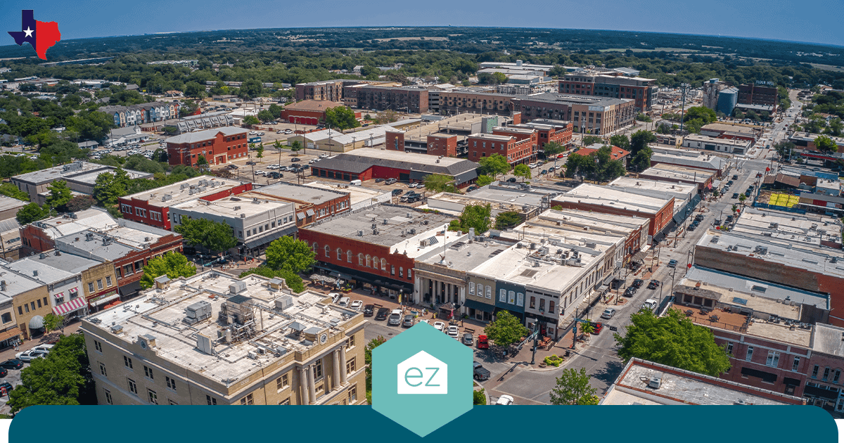 Aerial view of a small Texas town downtown with historic brick buildings