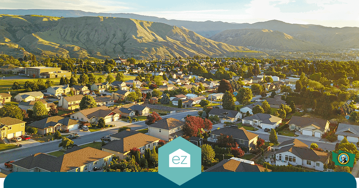 Aerial view of a Washington suburban neighborhood with mountains behind