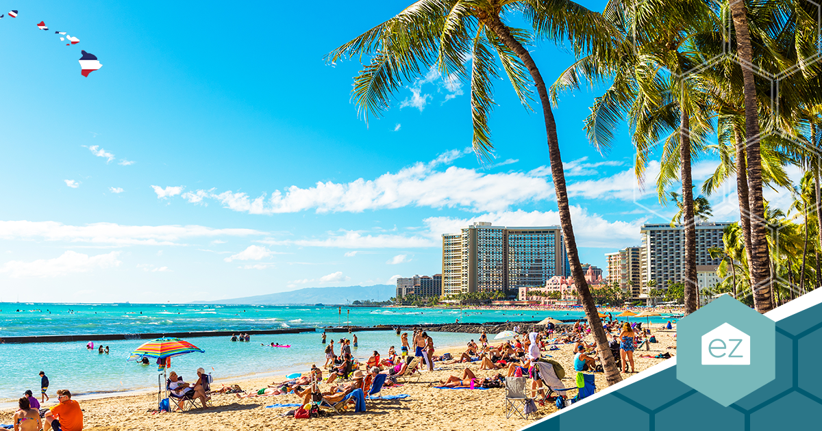 Palm trees and high-rise buildings line Waikiki Beach on Oahu, the tightest of Hawaii's four island real estate markets