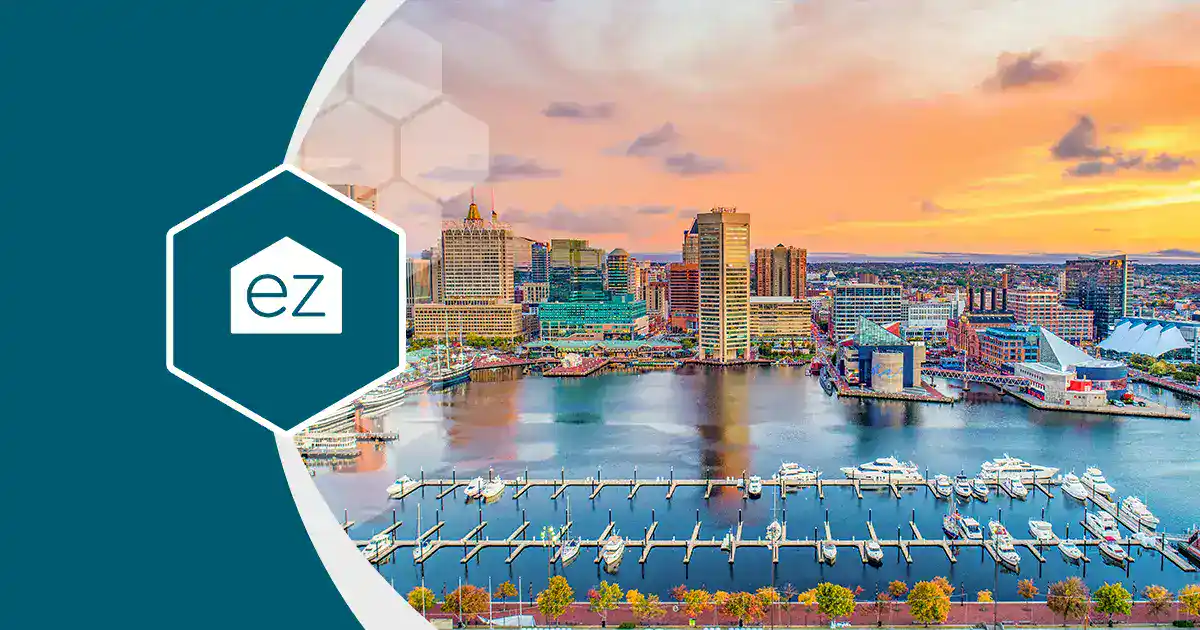 Boats docked along the Baltimore waterfront at sunset