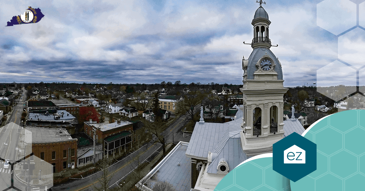 Aerial view of a Kentucky county-seat town with a clock-tower courthouse
