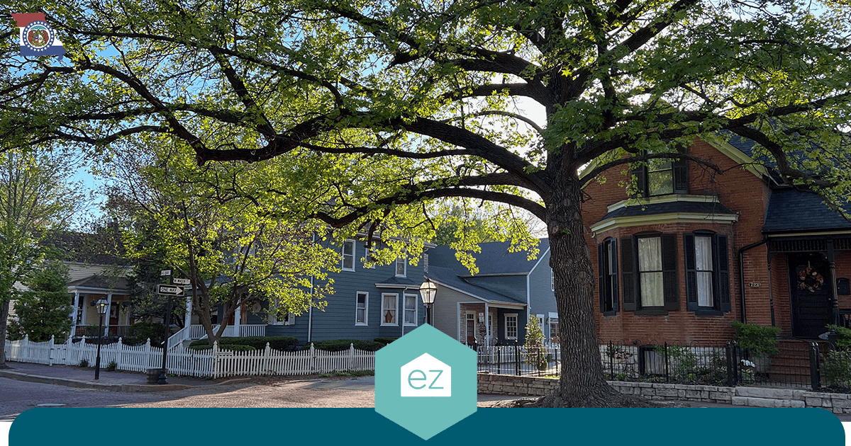 Tree-lined residential street of brick and frame homes in Missouri