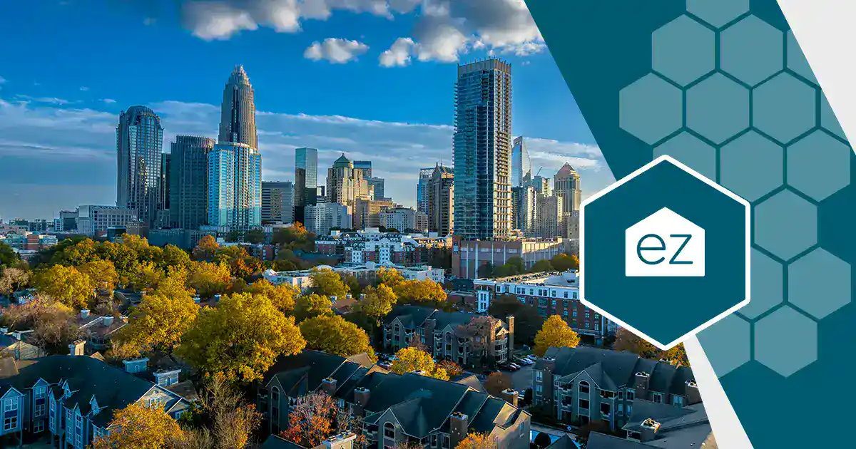 Aerial view of downtown Charlotte, North Carolina with autumn trees and residential blocks