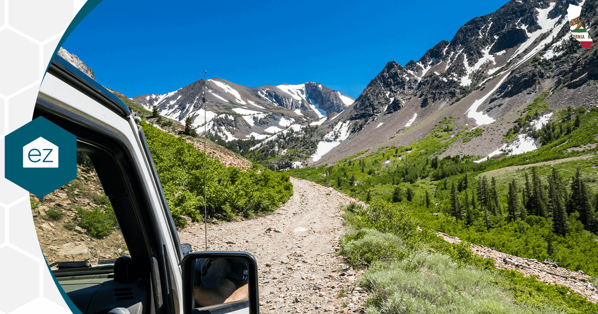 A vehicle on a scenic Sierra Nevada mountain road