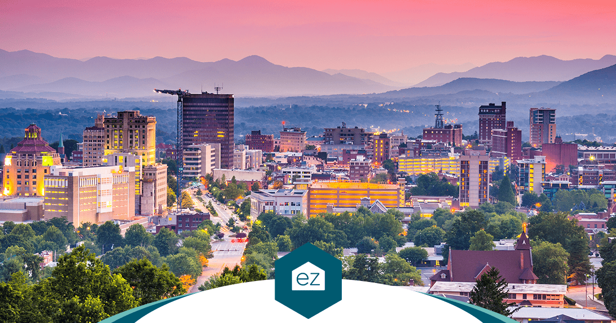 Asheville, North Carolina skyline at sunset with mountain ranges in the distance