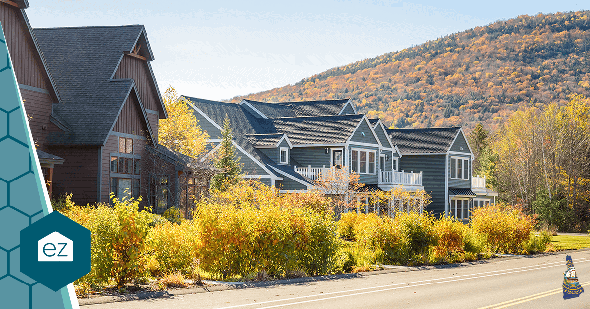 Row of New Hampshire homes with autumn foliage