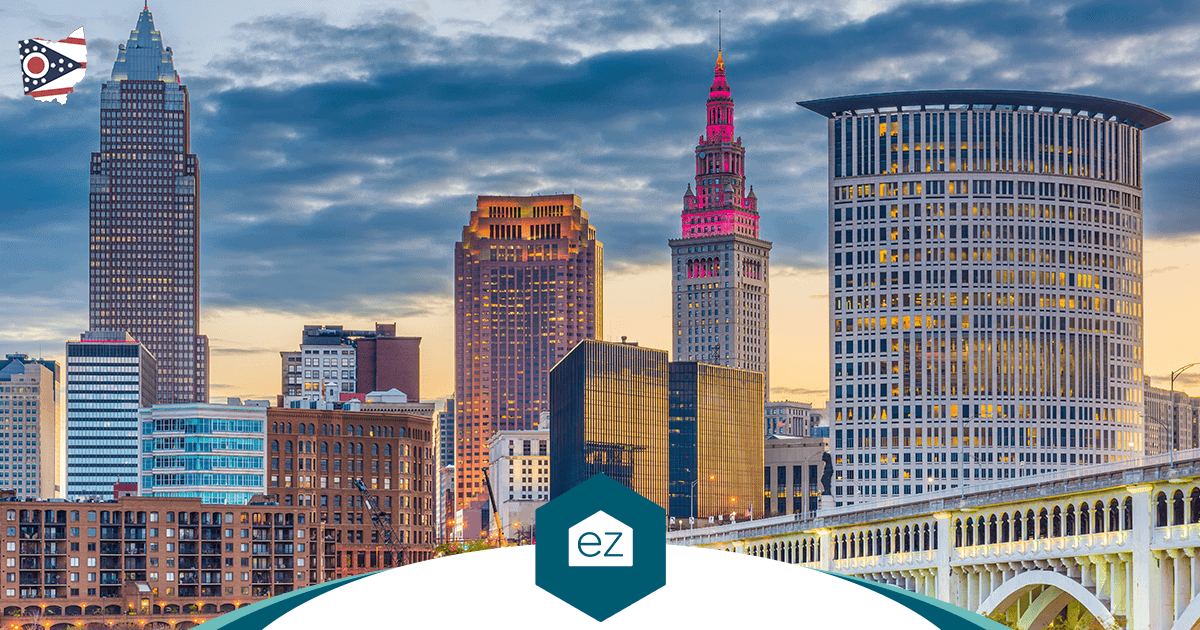 Cleveland, Ohio skyline at dusk with tall buildings and a bridge over the river
