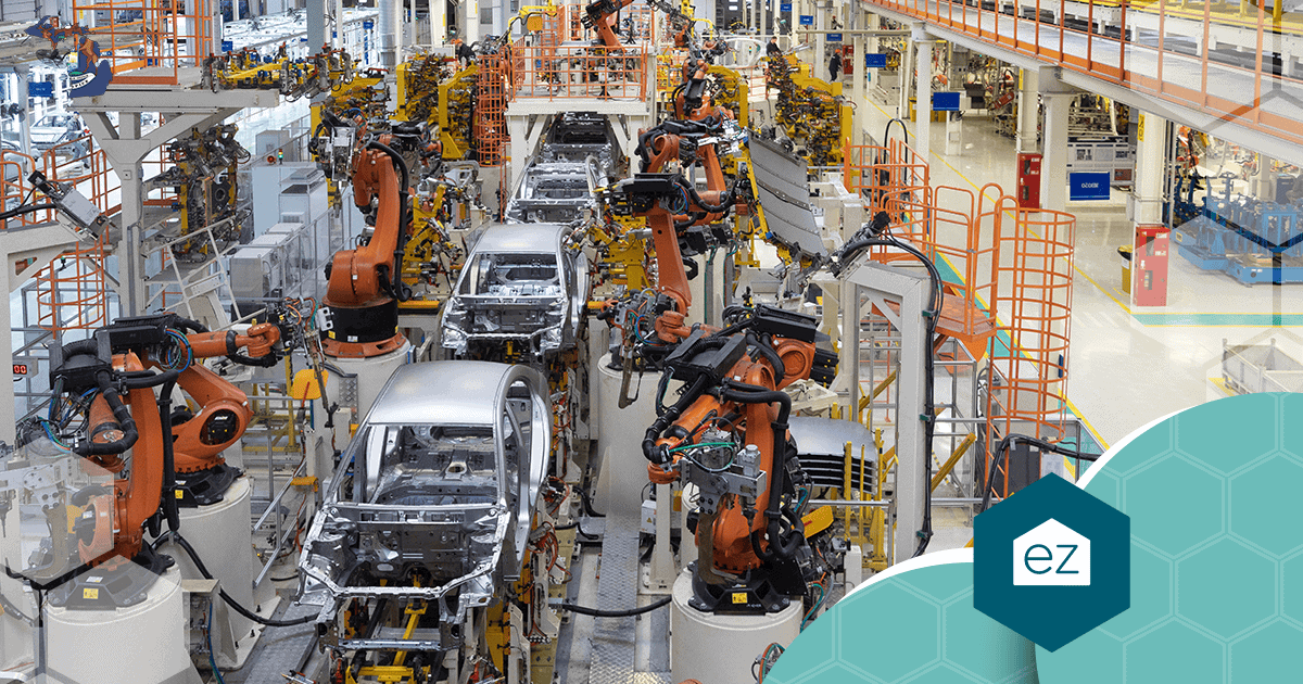 Automotive assembly line in a Michigan factory with robotic arms working on car bodies