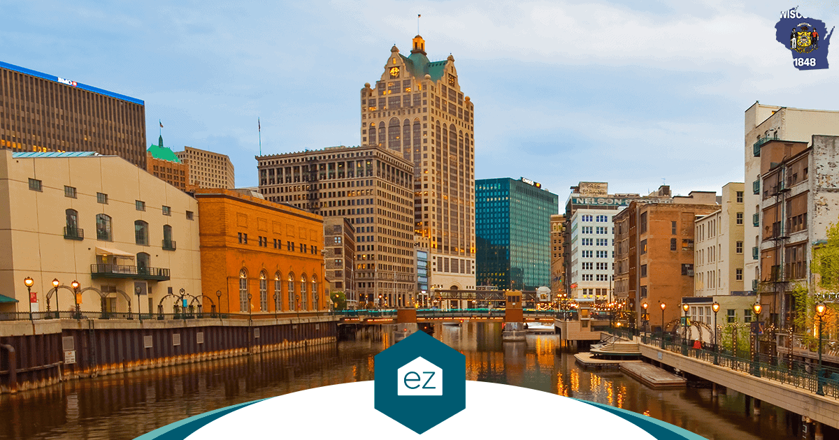 Downtown Milwaukee riverwalk with bridges and historic buildings along the Milwaukee River