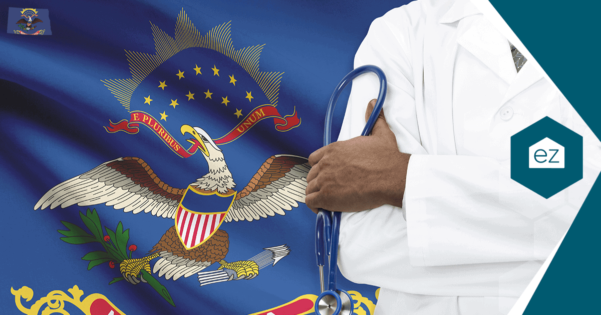 A healthcare worker holding a stethoscope in front of the North Dakota state flag