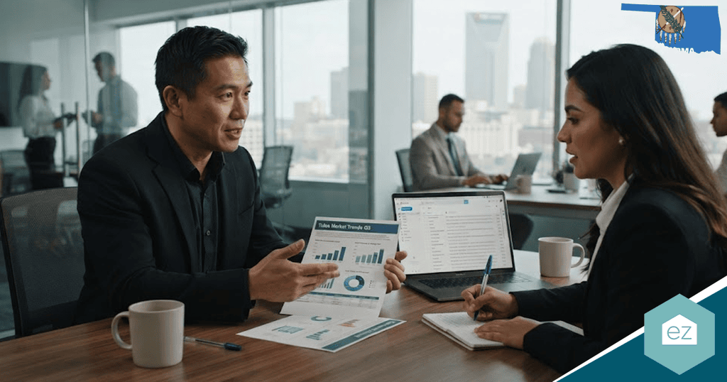 Two professionals in a modern office discuss Oklahoma real estate leads, sales growth charts, and financial data; laptops, documents, the state seal, and “ez” logo are visible.