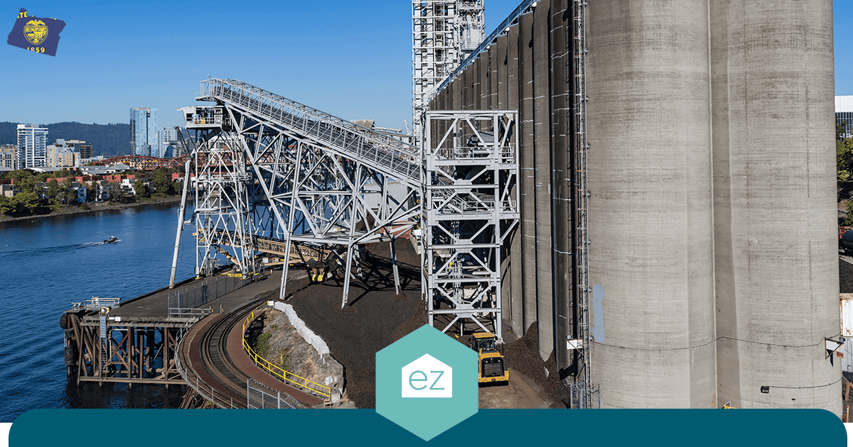Grain silos and a loading conveyor beside the Columbia River in Oregon