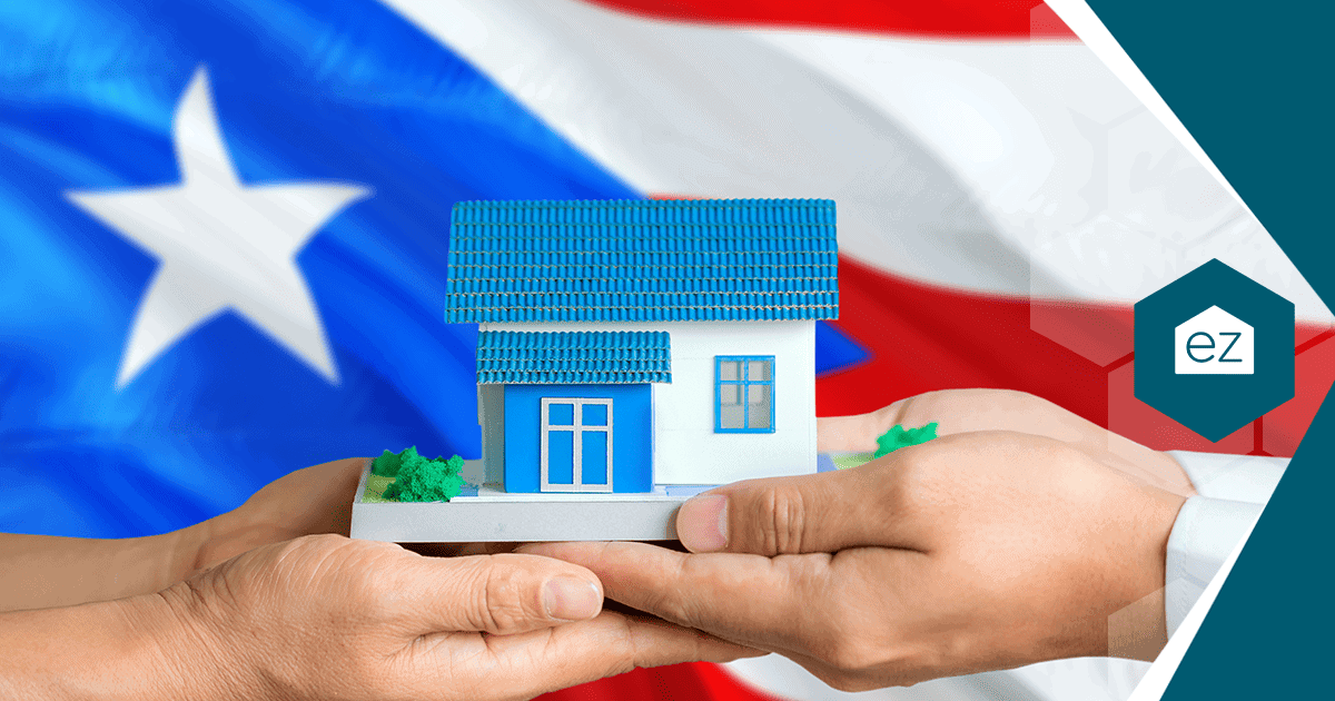 Hands holding a model house in front of the Puerto Rican flag