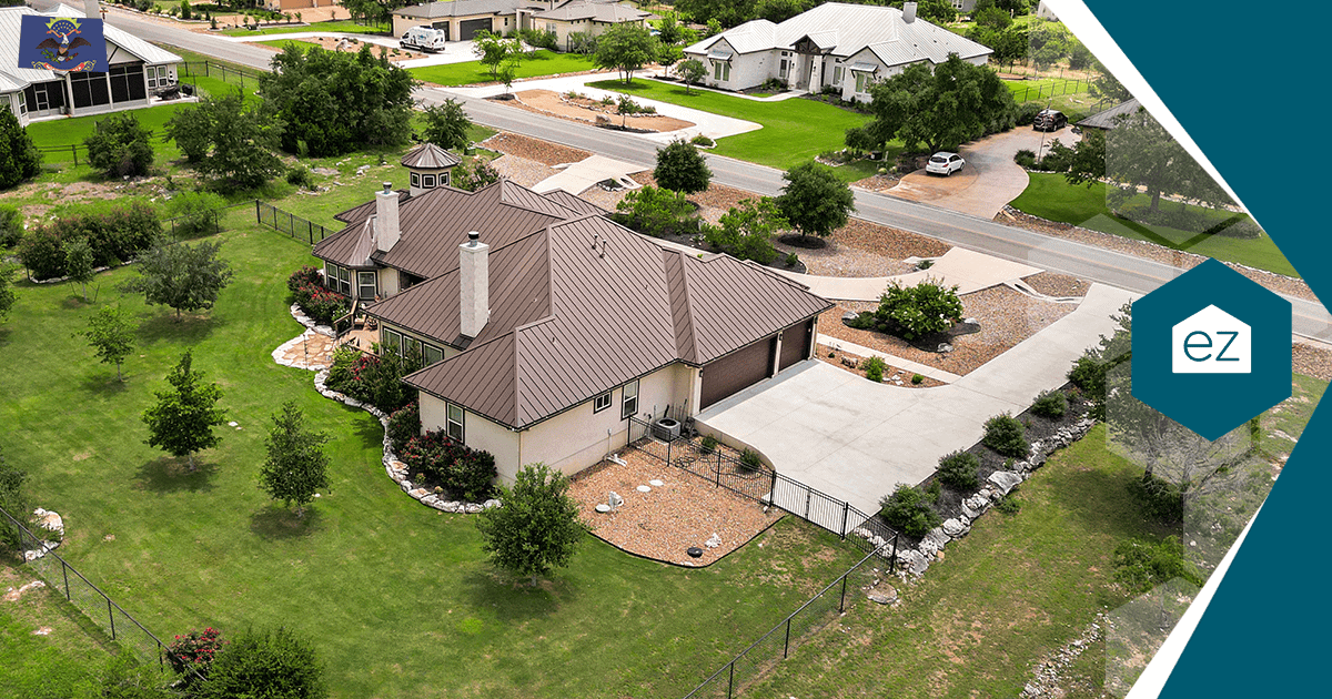 Aerial view of a single-family North Dakota home with a large yard and driveway