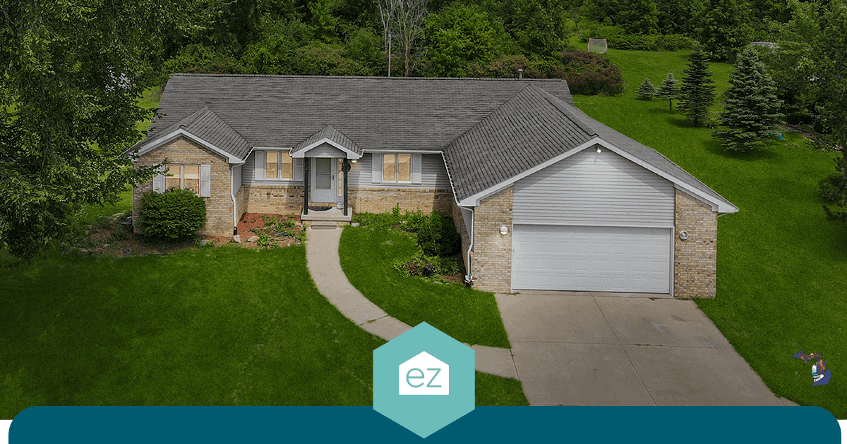 Single-story suburban ranch-style home in Michigan with an attached garage and trimmed lawn