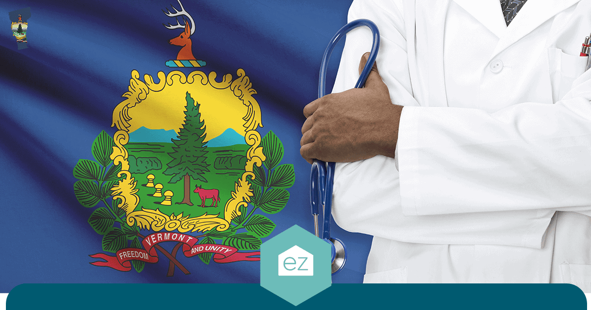 Health care worker in a white lab coat holding a stethoscope in front of the Vermont state flag