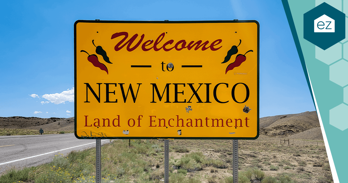 Welcome to New Mexico, Land of Enchantment roadside sign in a high-desert setting