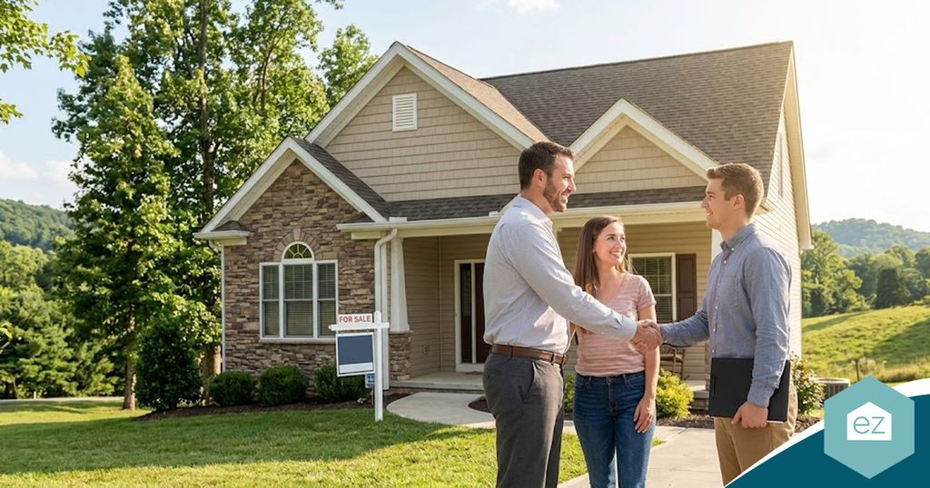 A real estate agent shakes hands with a couple in front of a house for sale, representing successful West Virginia real estate leads.