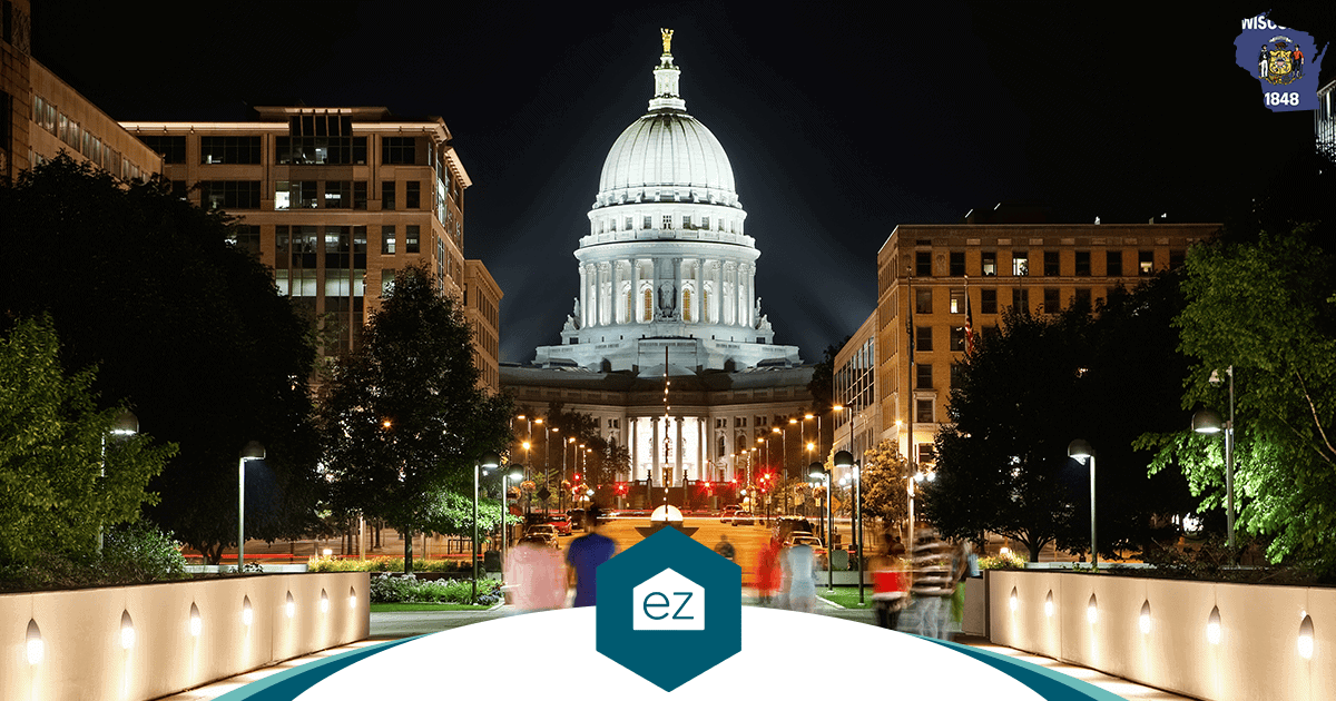 The Wisconsin State Capitol lit at night in Madison, the center of Dane County's housing growth